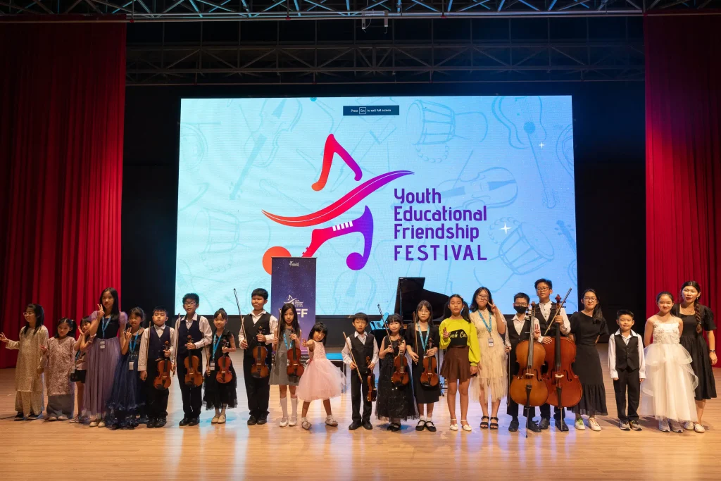 photo group of young kids who participate Youth Educational Friendship Festival Johor Baru 2023 at the stage