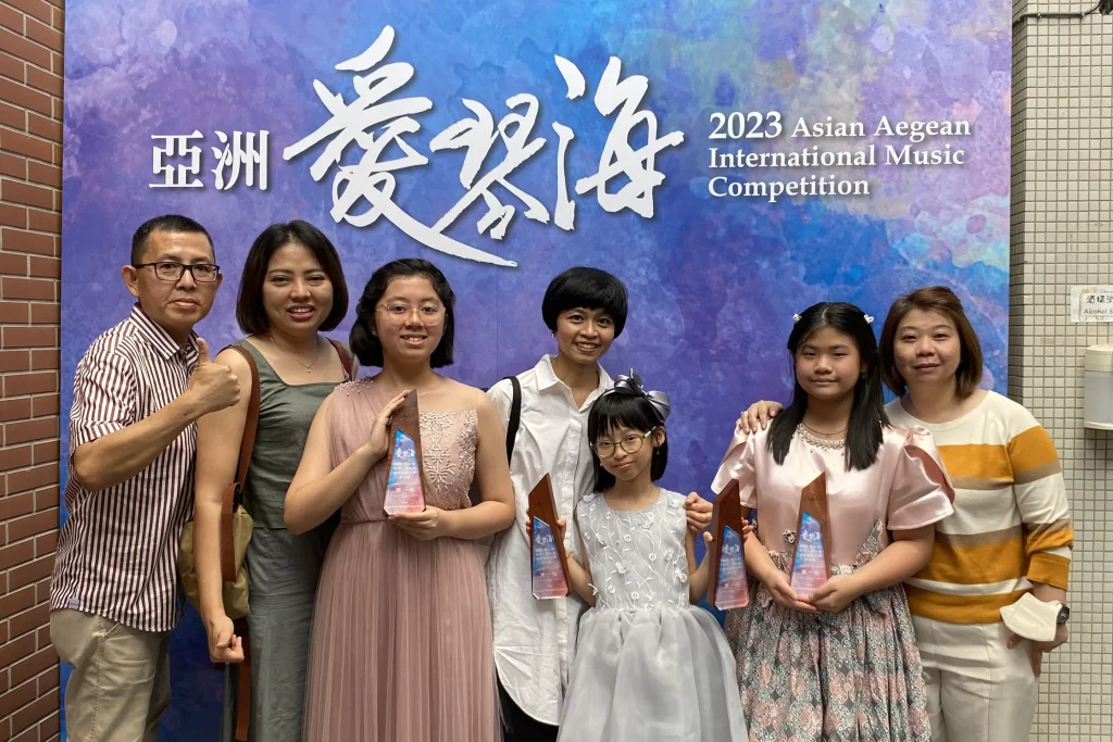 Group photo of participant Asia Aegean International Music Competition 2023 with her family
