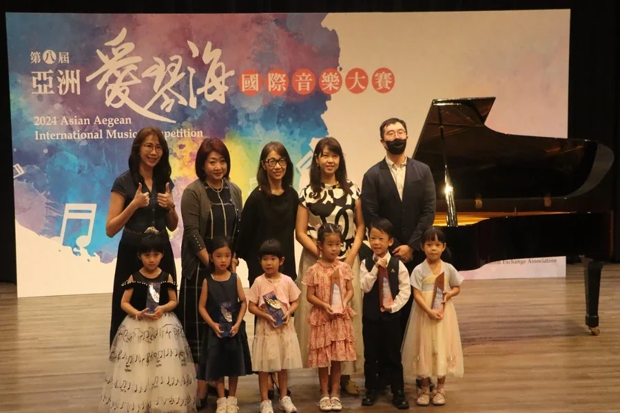 Asia Aegean International Music Competition 2024 photo group, participant and judges at the stage
