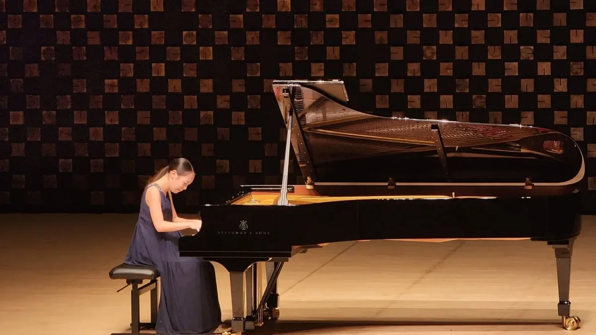 young pianist perform on international music competition